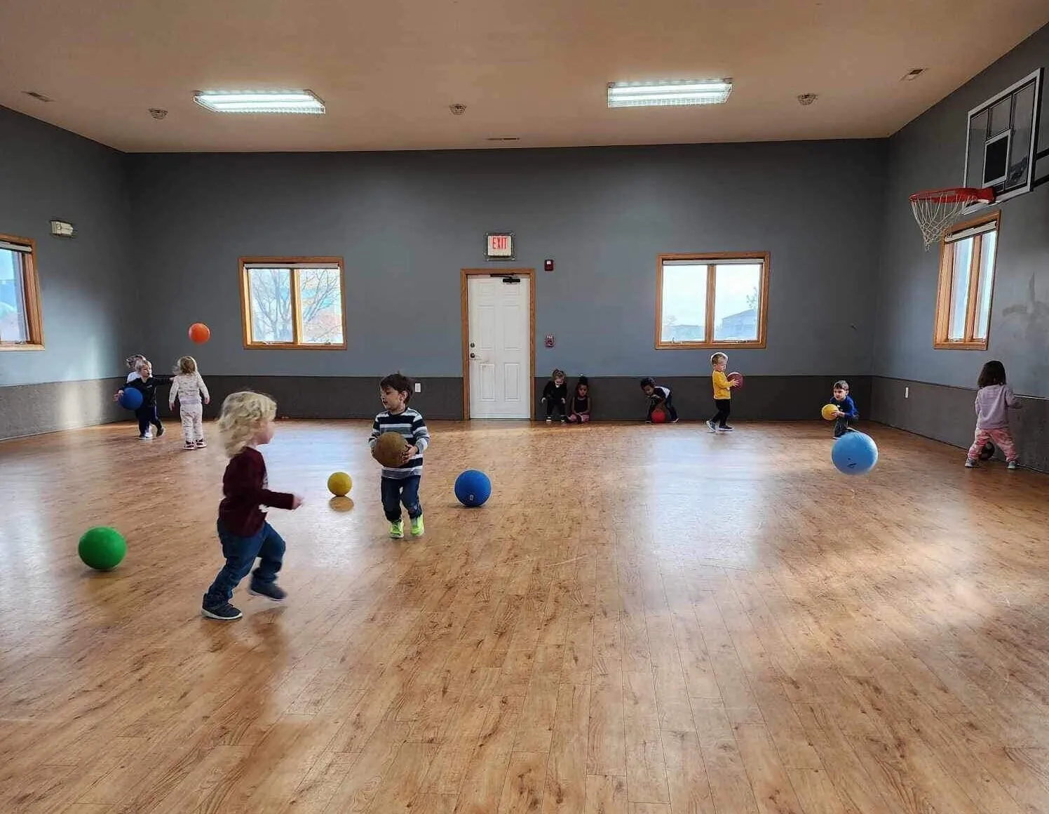 Kids playing dodgeball in the indoor gym