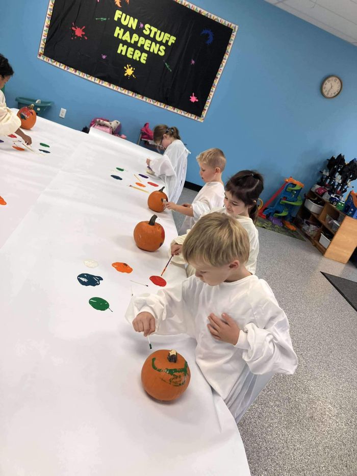 West Side Kids Painting Pumpkins